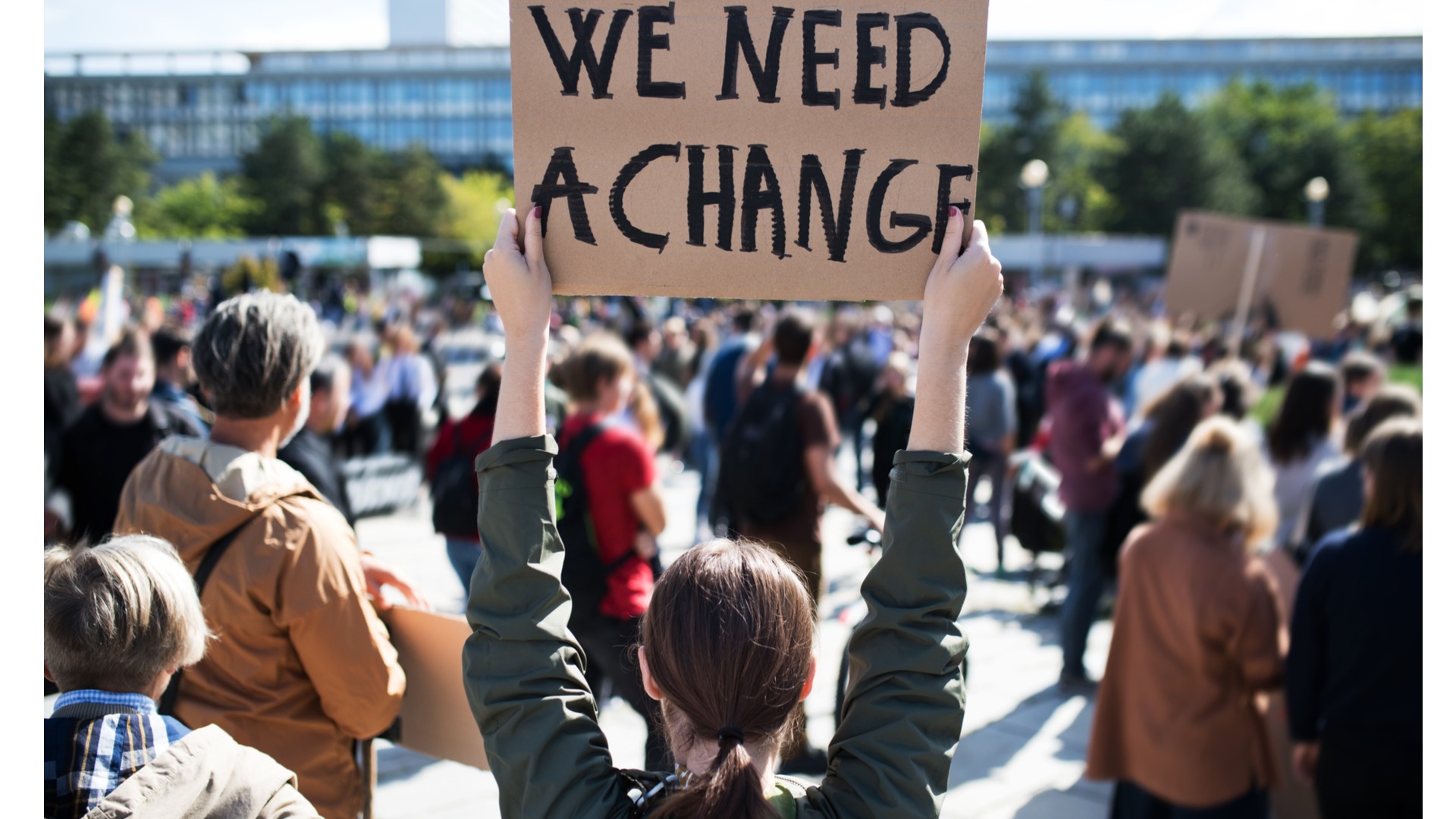 Girl holding a We need Change sign in theme with COP26 summit 