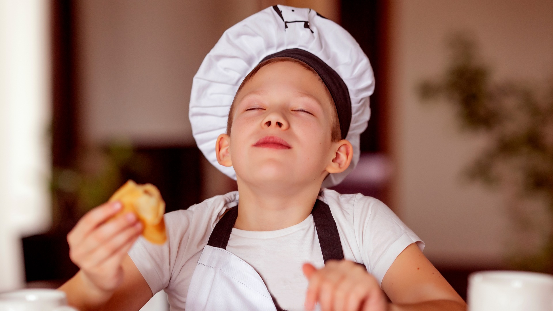 Little boy eating a pancake