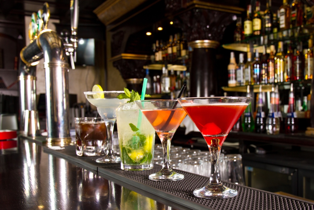 Five cocktails on bar counter